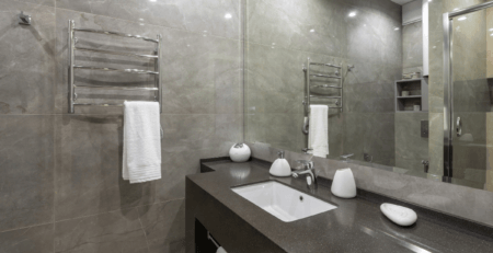 a stylish black granite bathroom worktop and basin surround.