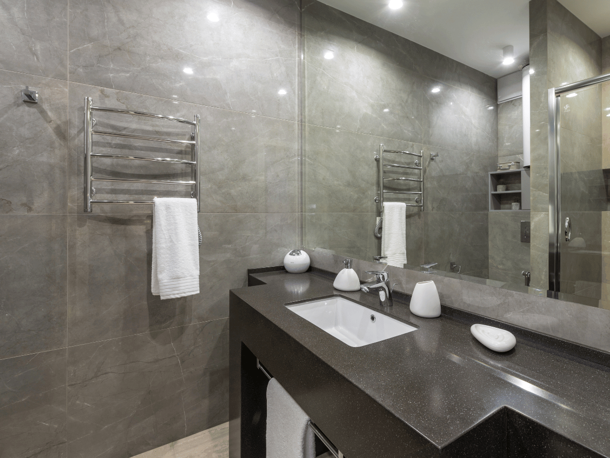 a stylish black granite bathroom worktop and basin surround.