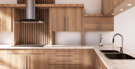 a newly refitted kitchen with scandi-style wood cabinets and stylish marble worktops.