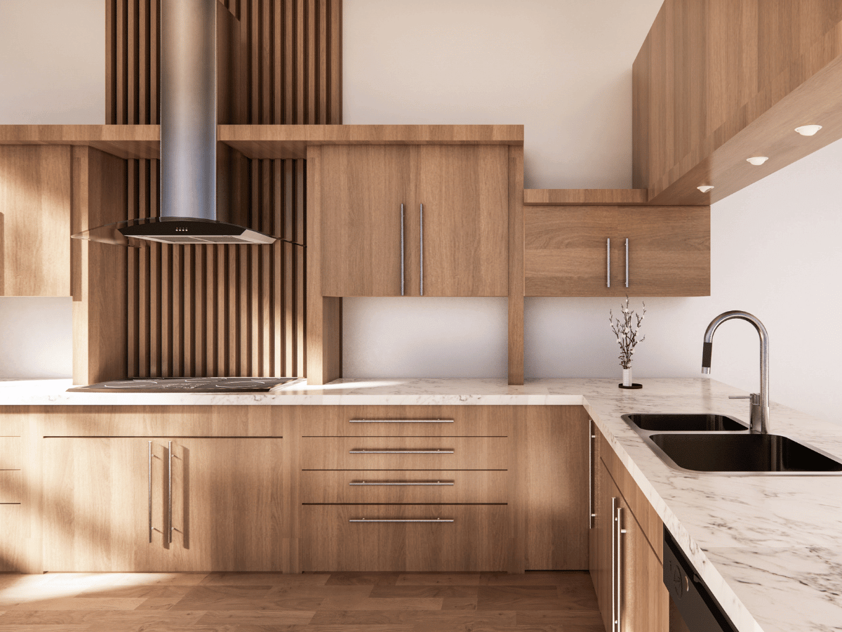 a newly refitted kitchen with scandi-style wood cabinets and stylish marble worktops.